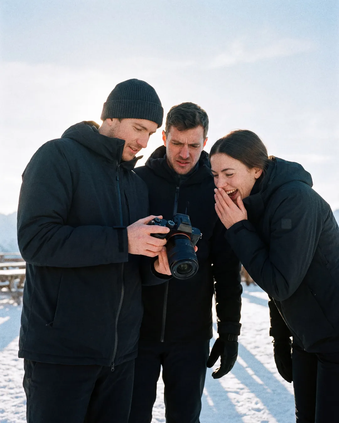 Photographer showing images to a couple